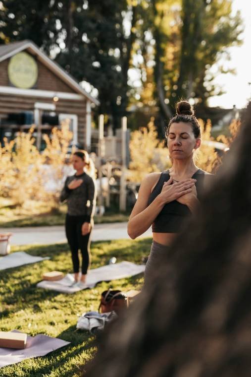 A small group practicing yoga outdoors